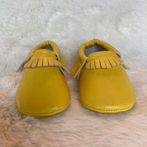 Yellow baby moccasins